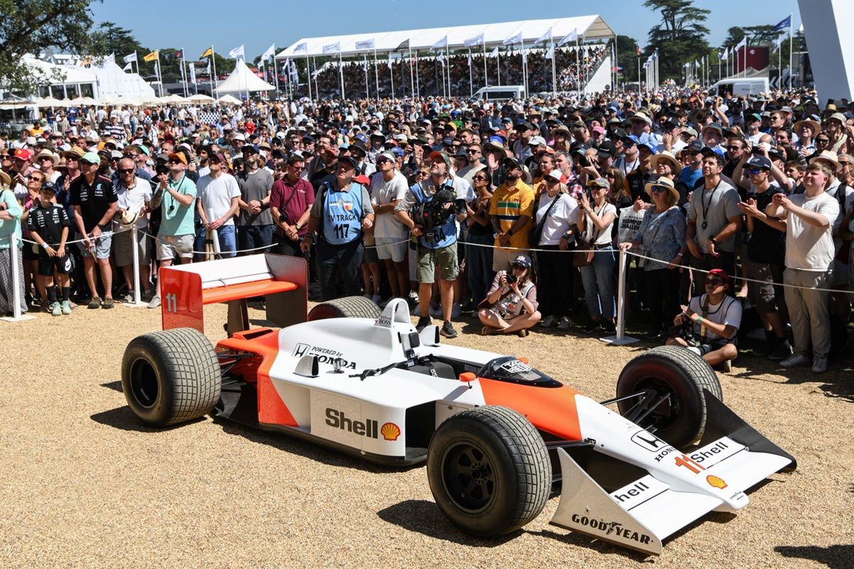 Alain Prost’s 1988 McLaren MP4/4 and Goodwood crowd